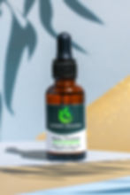 Relax CBD and CBN Tincture by Cosmec Healing displayed with green and gold background