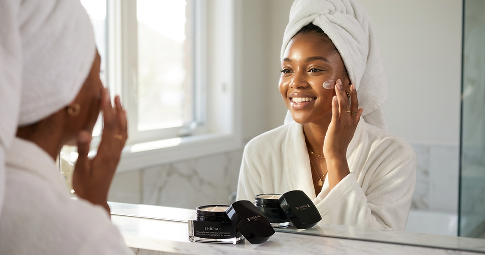 Young Woman Nourishing Her Skin with Loving Me Beauty's Embrace Collagen Moisturizer
