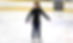 Ice skater on rink with ASC merch.