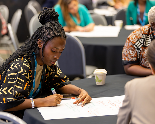 Person writing in a breakout session