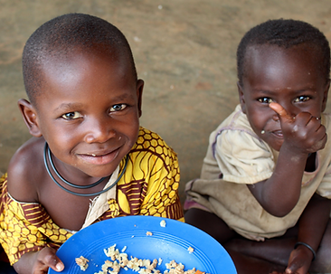 Starving children are fed by the meals packed by volunteers