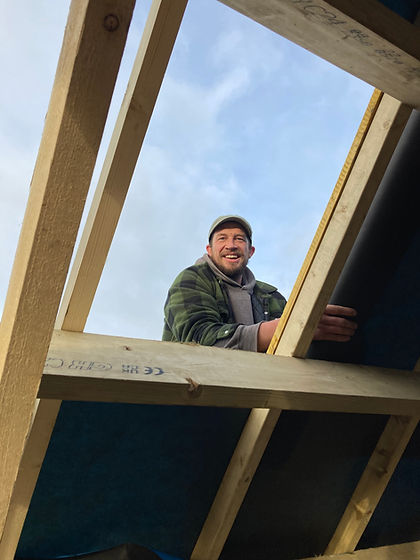 Calum working on a roof