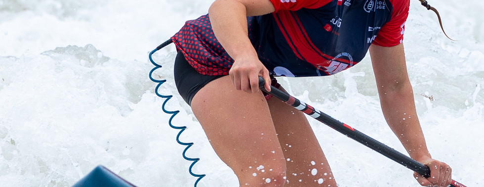 SUP Racer surfing a wave