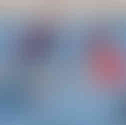 Junior SUP racers in red and blue GBSUP tops with red marker buiy