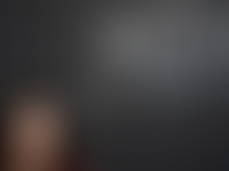 A woman stood next to a chalk thought bubble that has the word Delta T within it.