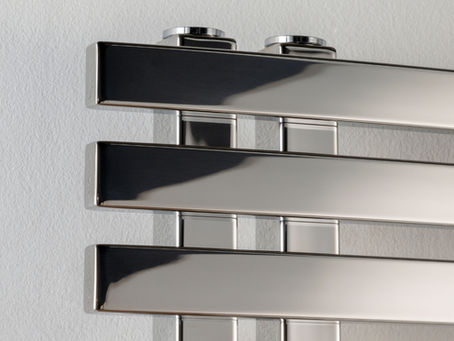 A closeup of a chrome towel rail