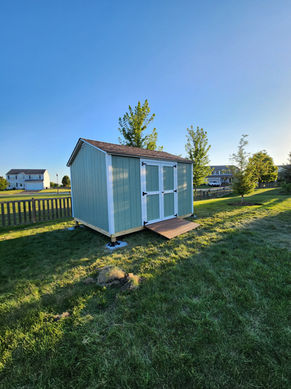 Green shed in a backyard