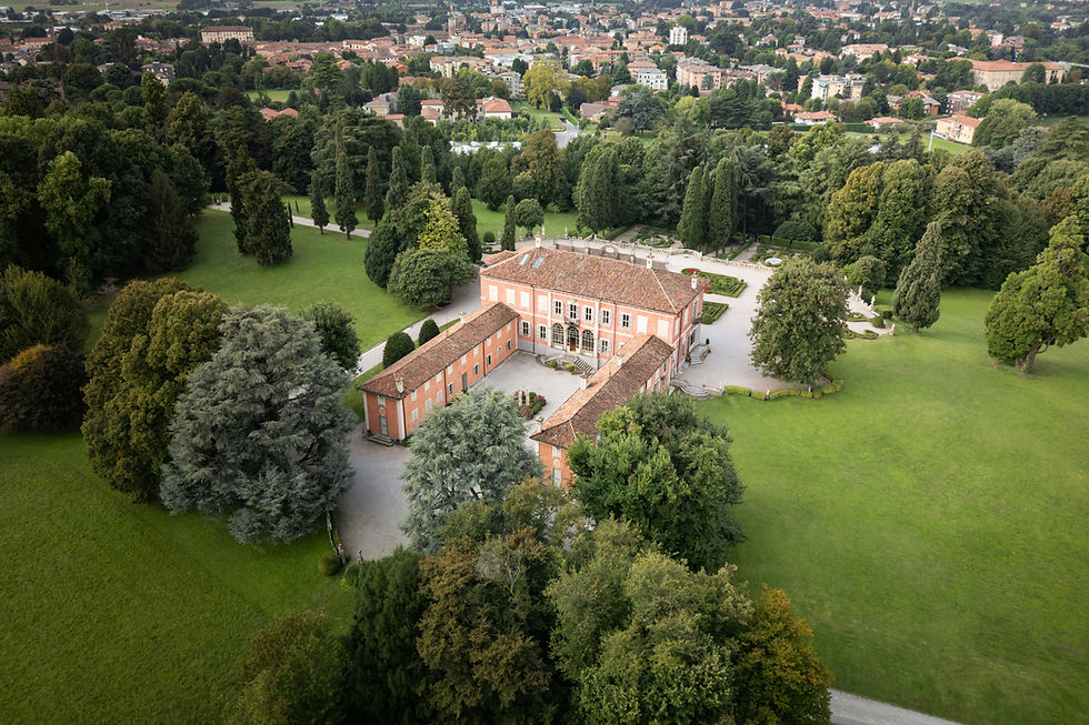 Aerial view of a large building with surrounding trees My Site 12