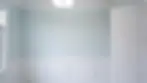 Bedroom makeover in Chelsea featuring a freshly painted feature wall and modern neutral tones