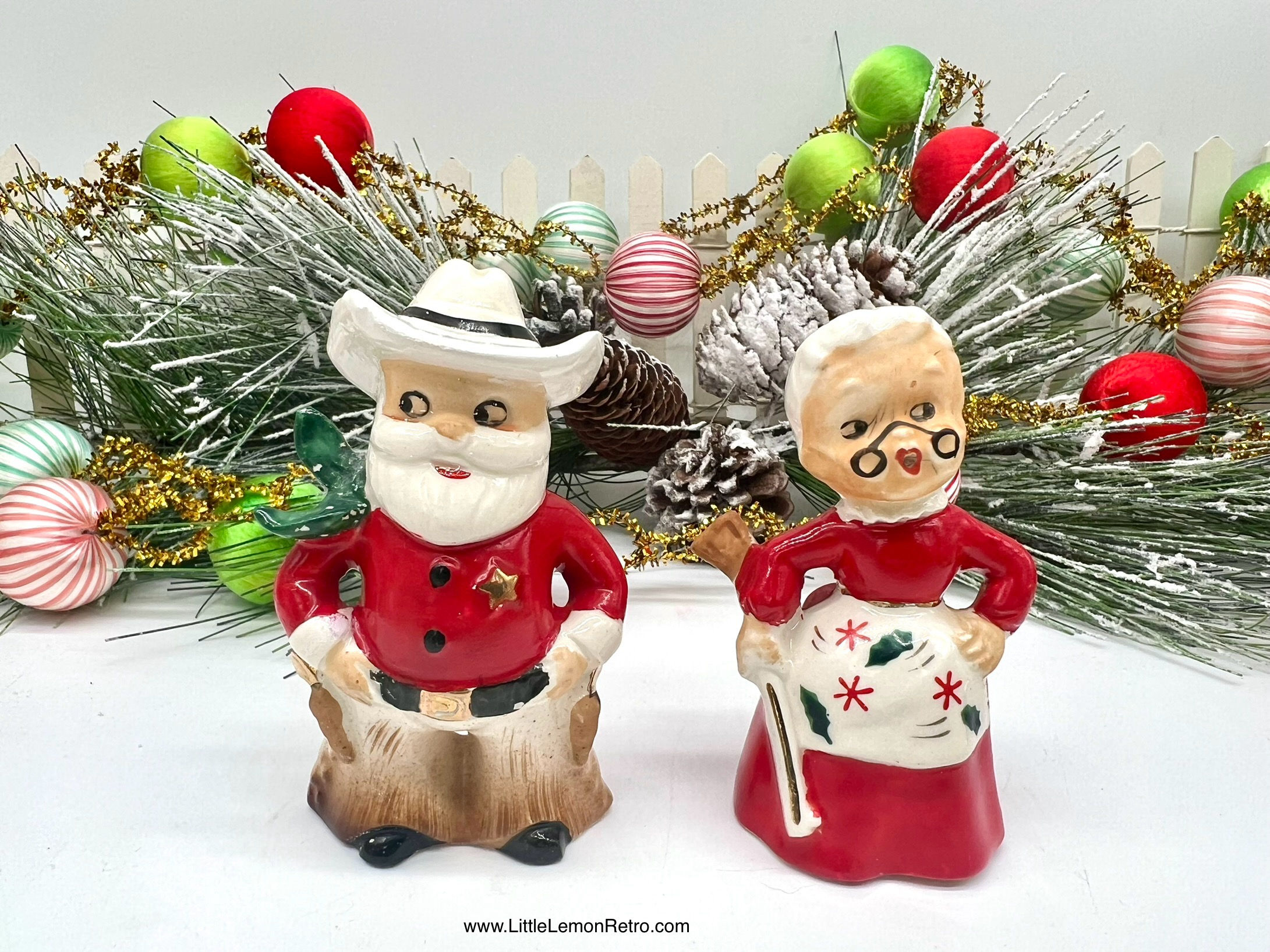 1950s cowboy sheriff Santa and rifle-toting Mrs. Claus vintage western-themed