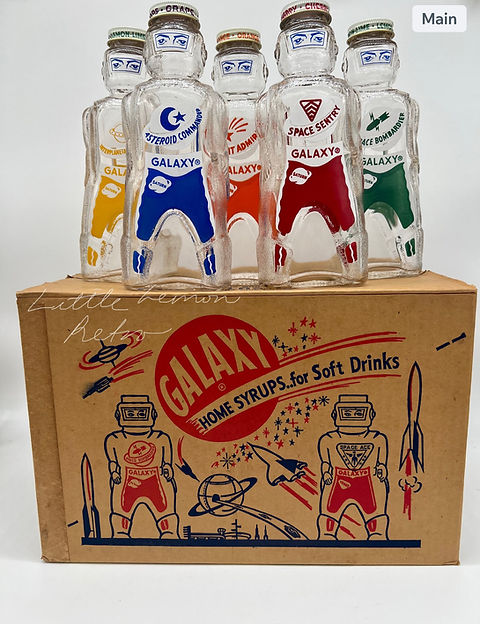 Vintage 1950s atomic age Galaxy spaceman soda syrup bottles and
