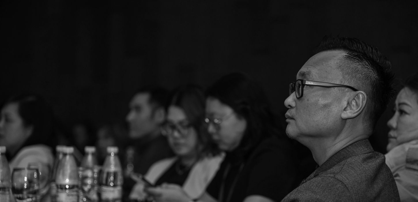 Audience intently watching a presentation