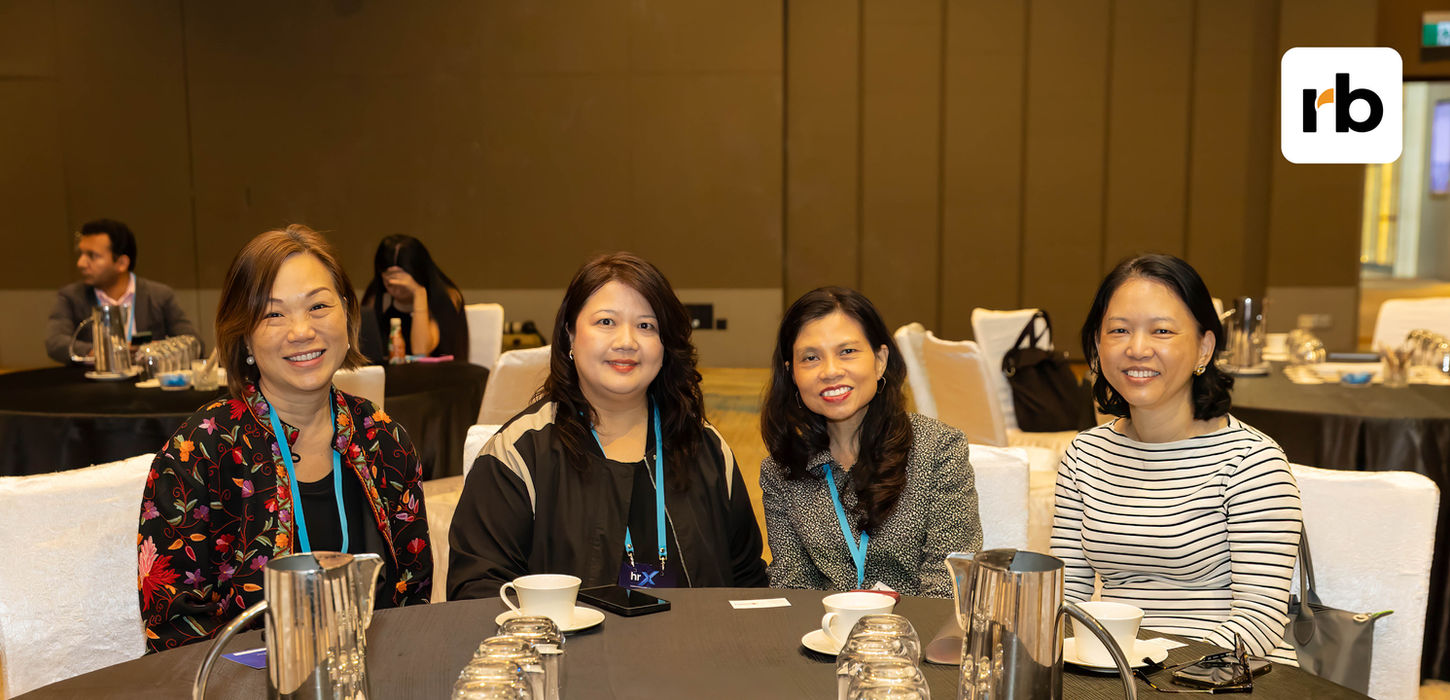 Rockbird contact us team smiling at an event.