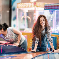 Friends celebrating and posing for a selfie at The Fun Lab in Blaine, MN.