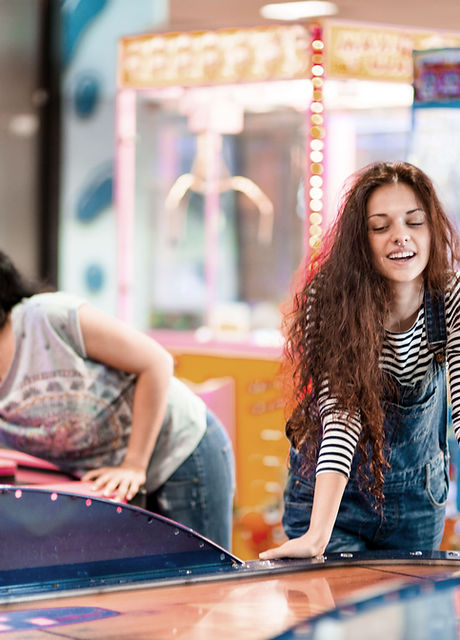 Girls Playing at Arcade