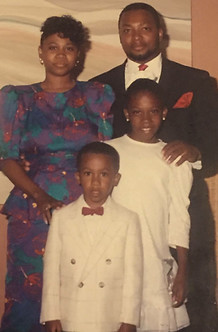 A photo of a young Chris, his older sister Shamika, and his parents - Ernestine and Philip