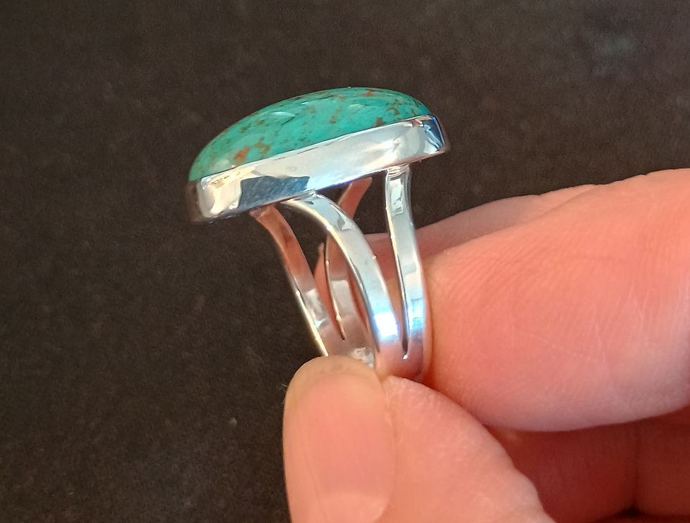 Side view Nevada turquoise ring showing plain bezel and split flat shank, signed LAS, size 11