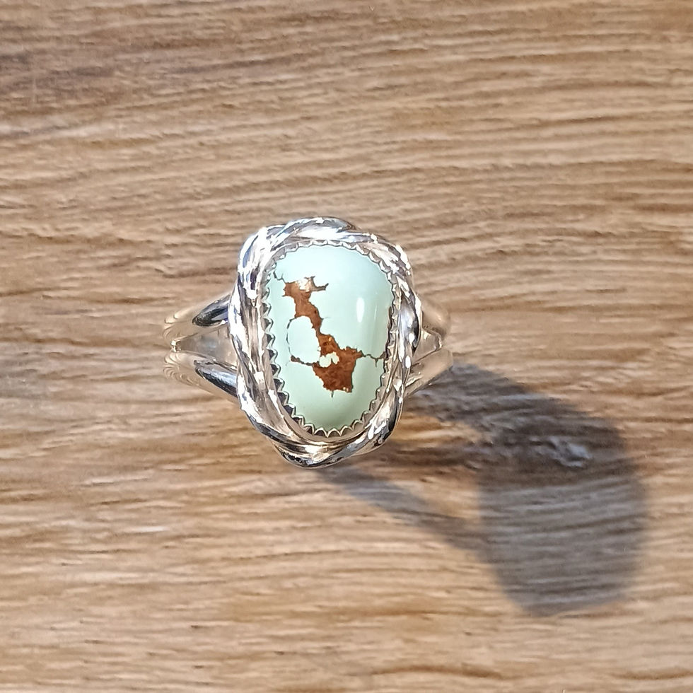 Freeform Number 8 turquoise sterling silver ring with a striking center matrix and twisted square wire bezel.