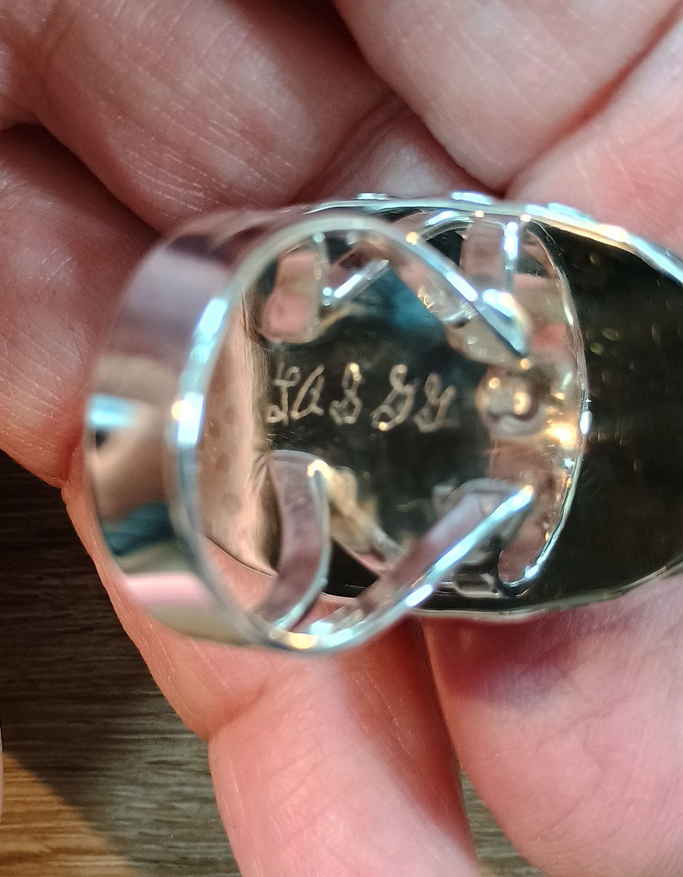 Thumbnail: Underneath backplate showing hand-engraved maker signature inside split shank.