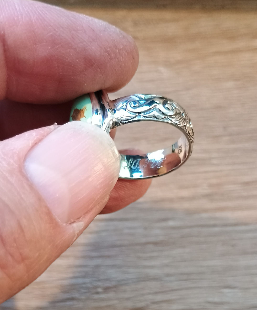 Inside ring band showing engraved maker signature and .925 stamp.