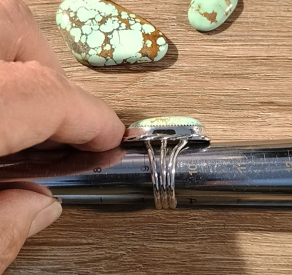 A natural Number 8 turquoise sterling silver ring displayed on a metal ring mandrel, accurately measuring exactly size 9.5.