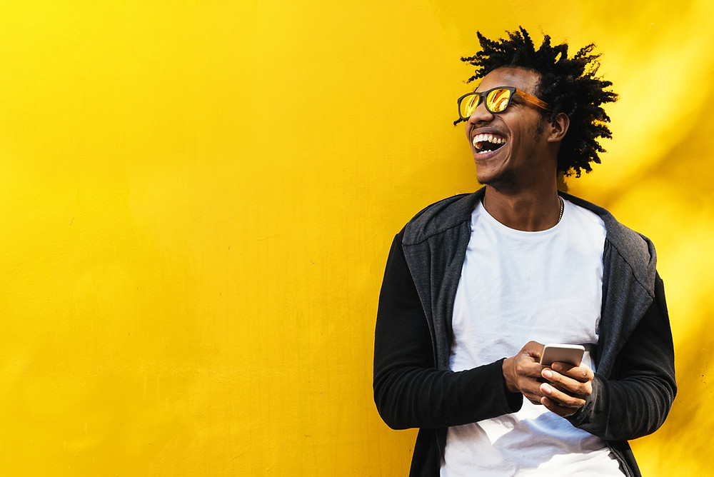 Photo of a very happy guy on a mobile