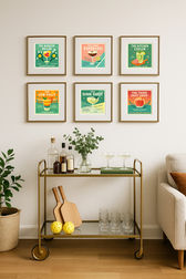 Photograph of a bar cart area in a living oom with pickleball cocktail wall art hanging on the wall.