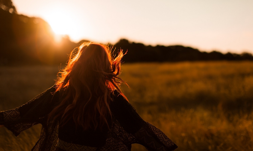 Website woman in field image.png