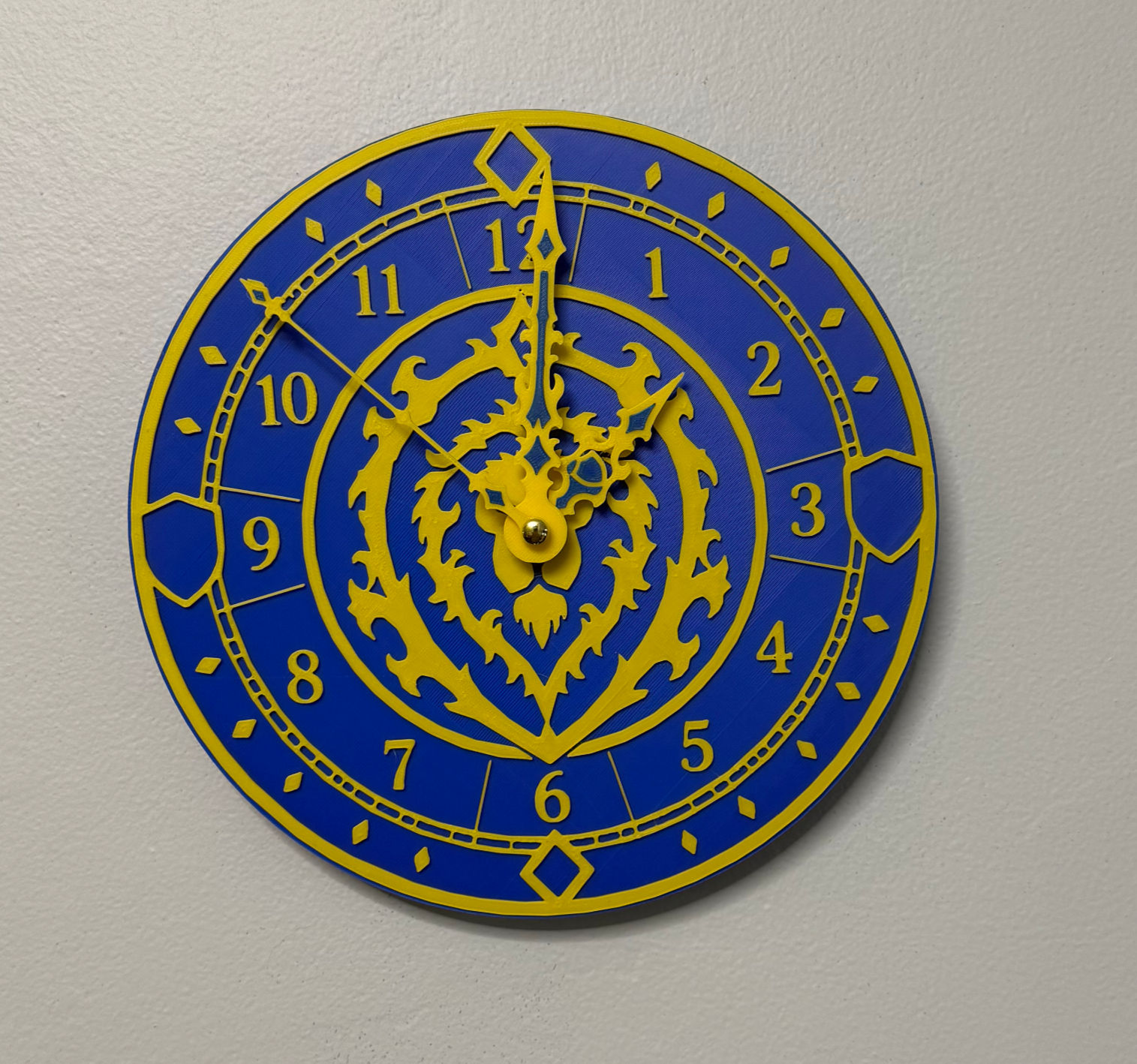 Blue and gold Alliance inspired WOW gaming wall clock with raised numbers, custom clock hands, and 3D printed fantasy faction