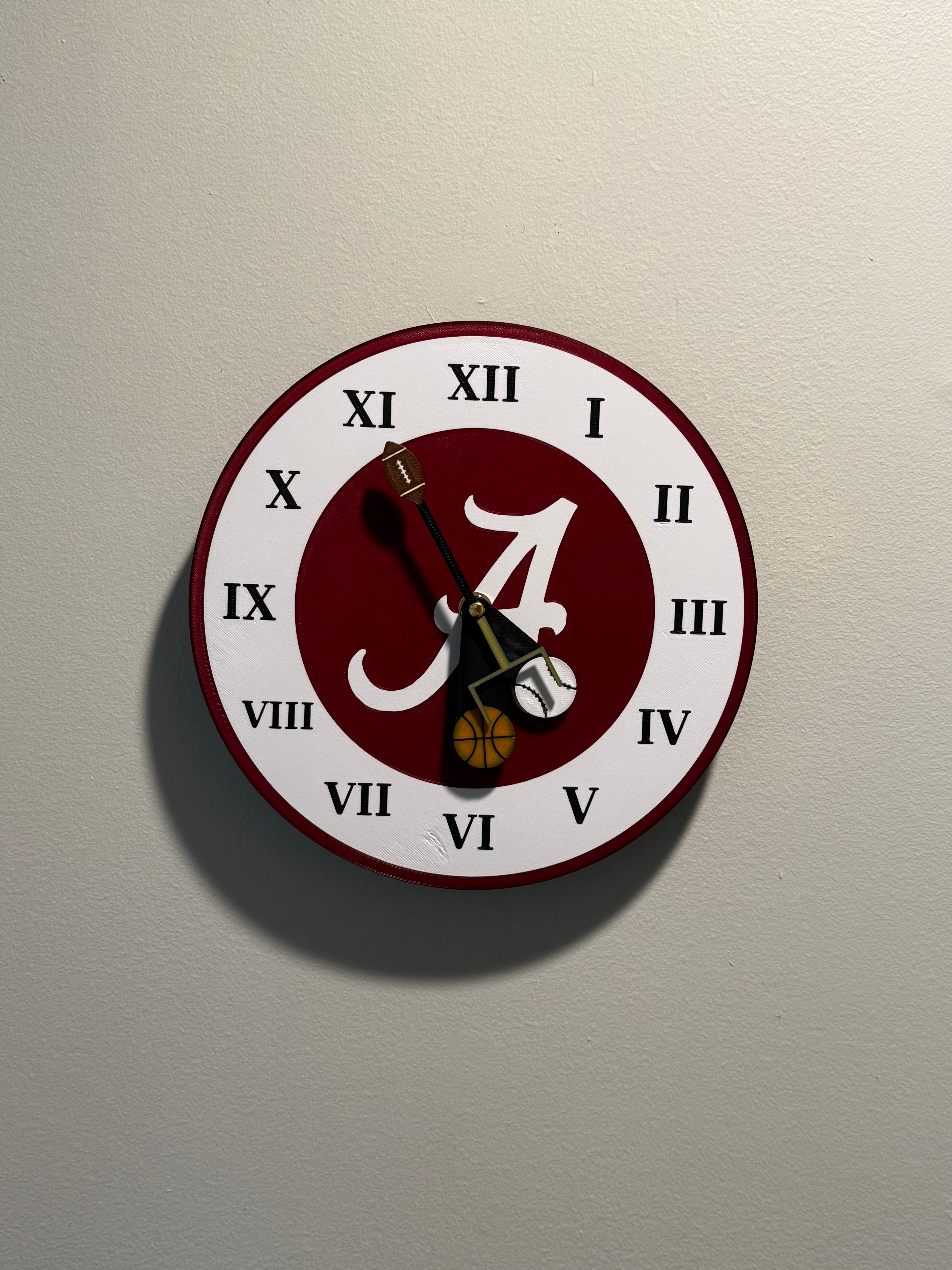 Custom Alabama-inspired football wall clock, 3D printed in crimson and white with Roman numerals and a sporty fan-made design