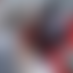 A woman on a boat with a group of children showing them a booklet about fishing lures