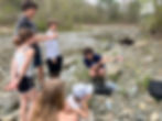 The Connecticut River Conservancy’s AmeriCorps service member, Bay Holmes (pictured left), exploring the Rock River with Hilltop Montessori students. Students gathered around Bay on a ricky riverside as Bay holds up water quality monitoring tools.