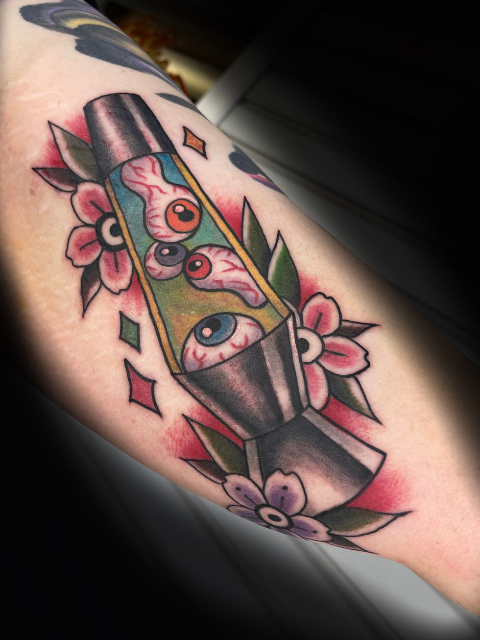 a tattoo of a lava lamp with flowers around it