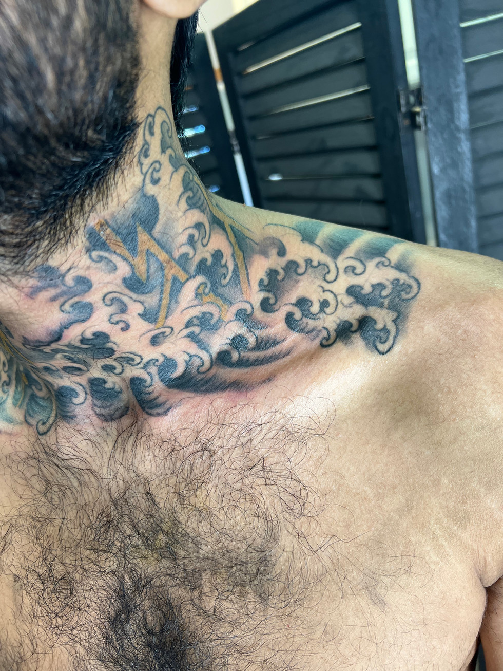 a man has a tattoo of a lightning bolt on his neck