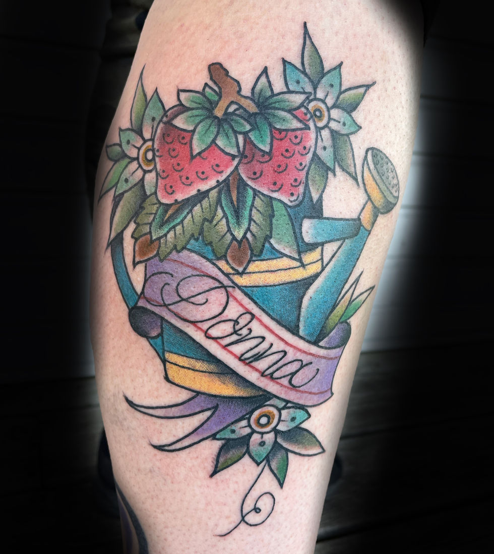 a tattoo of a watering can with strawberries and the name donna
