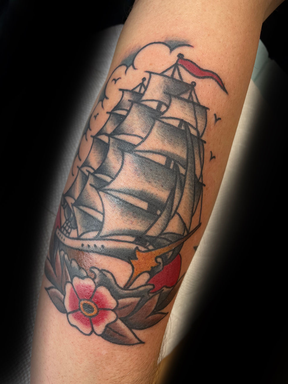 a person has a tattoo of a ship and flowers on their arm