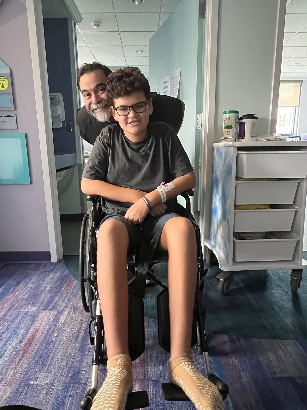 Nicholas in a wheelchair