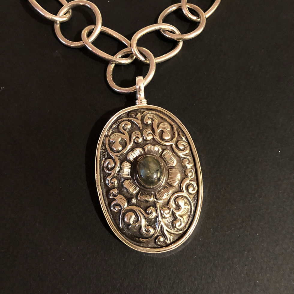 2.5 inch double-bezel silver oval pendant with labradorite stone in the center - by Coreen Cordova Jewelry