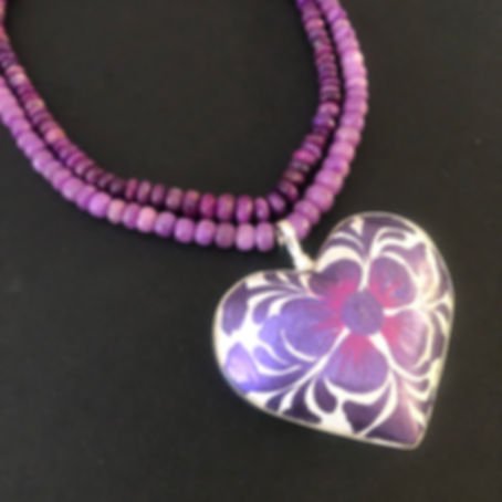 Three-dimensional purple and white heart charm by Coreen Cordova