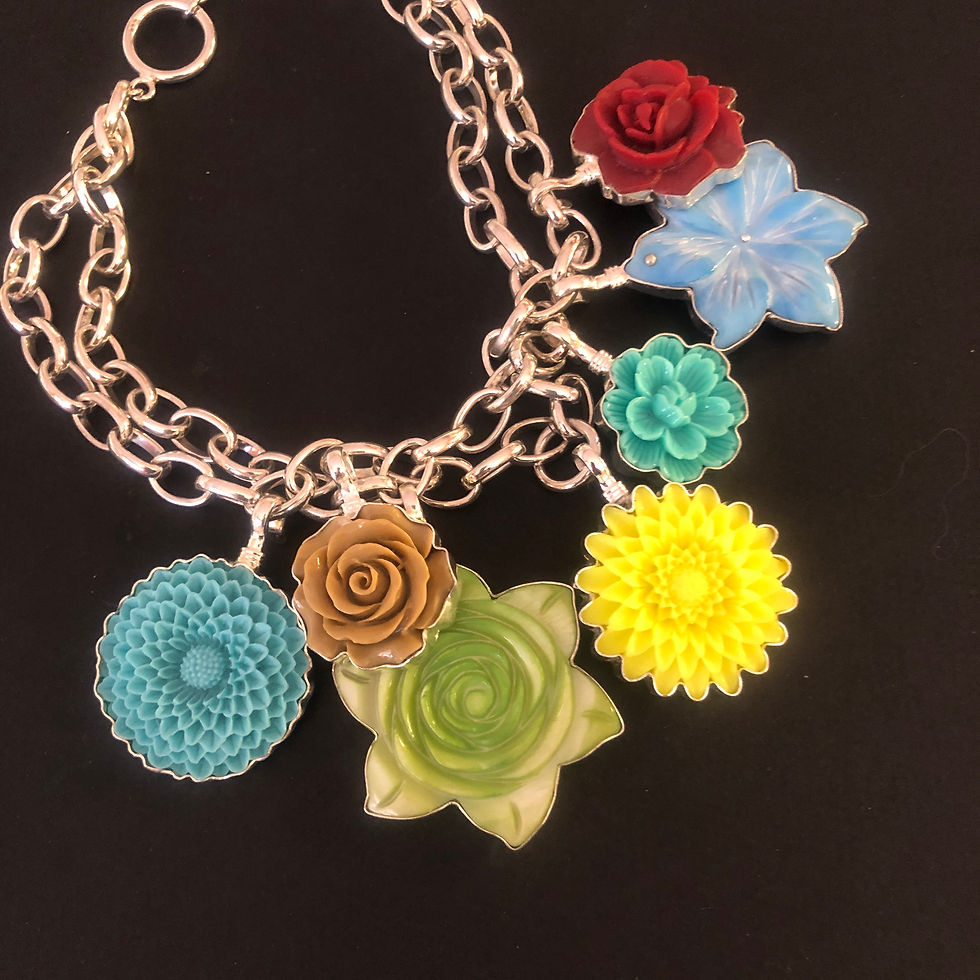 Seven assorted flower charms on a silver chain - by Coreen Cordova Jewelry