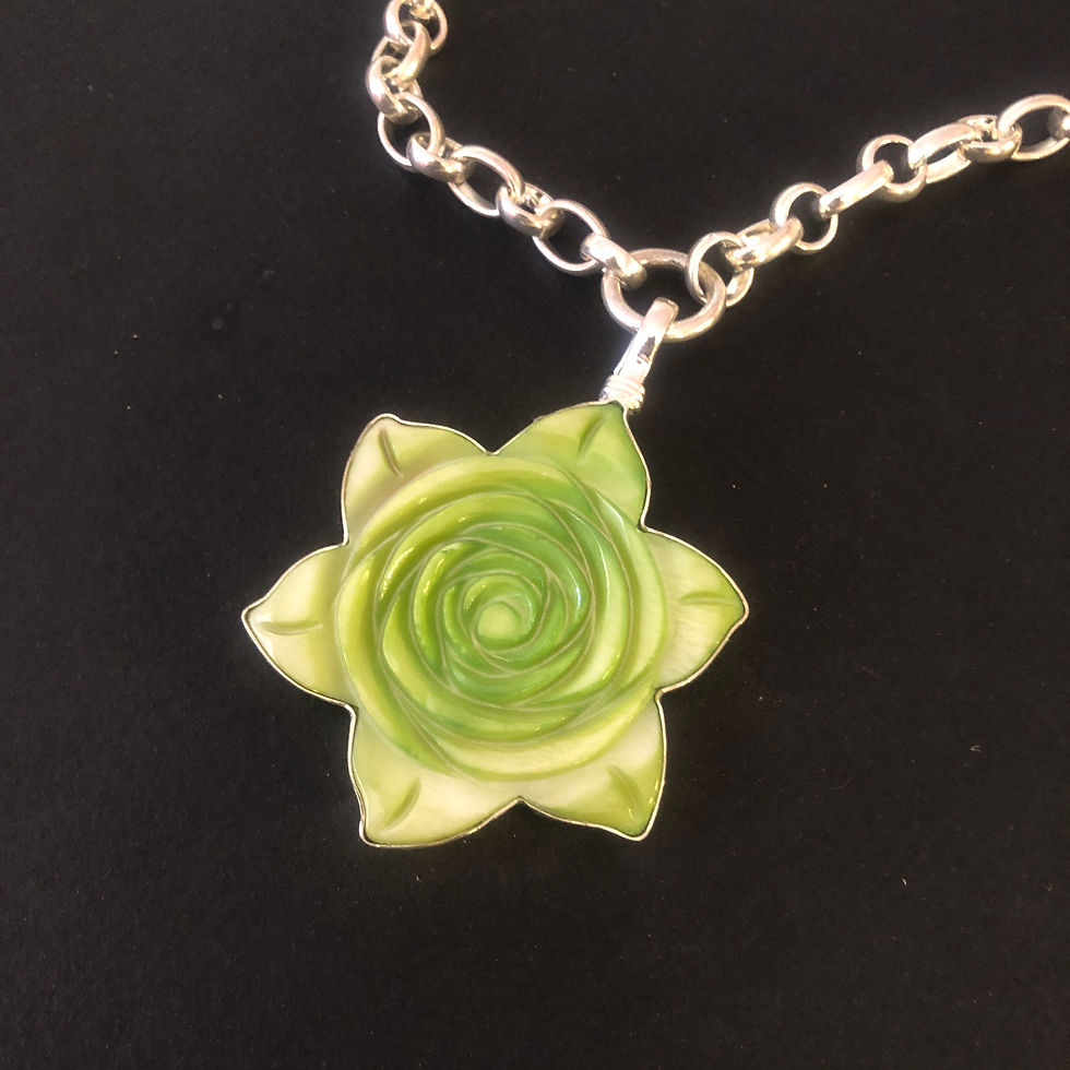 a 2 inch lime green mother of pearl flower charm by Coreen Cordova