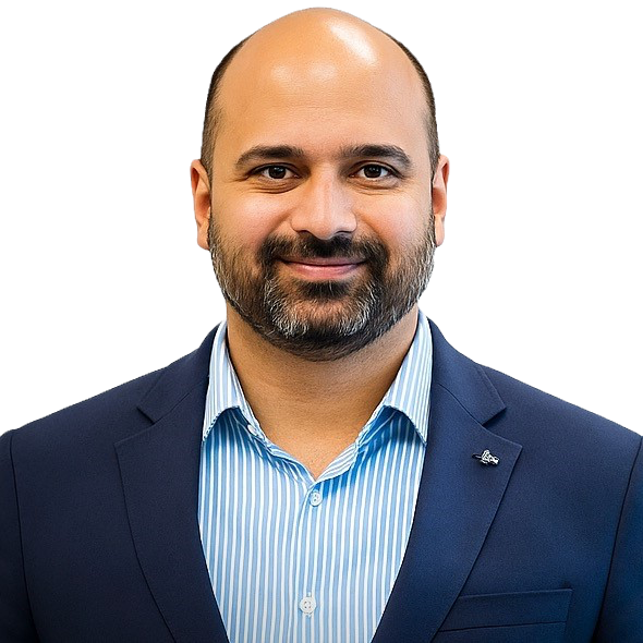 Photograph of Prof Ajay Chakravarthy wearing a blue suit on a plain background.
