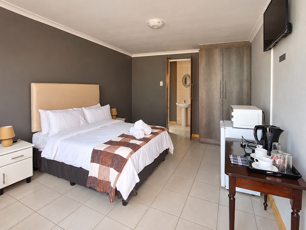 Cream headboard guest room.png