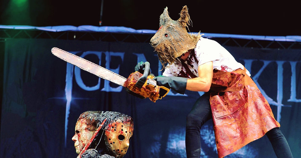 Ice Nine Kills performing at Rock im Park 2022 — band member wielding a chainsaw in a theatrical horror stage scene on the Mandora Stage, Nuremberg, Germany