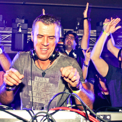 Jay Lumen behind the decks, delivering a high-energy techno set to a packed dancefloor.