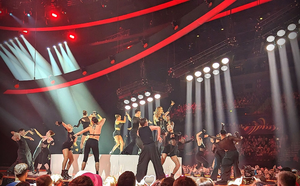 Rita Ora performing a career-spanning medley at the Eurovision Song Contest 2023 in Liverpool, representing a full-circle moment in her music career.