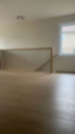 Light wood flooring and matching staircase railing: Our Results.
