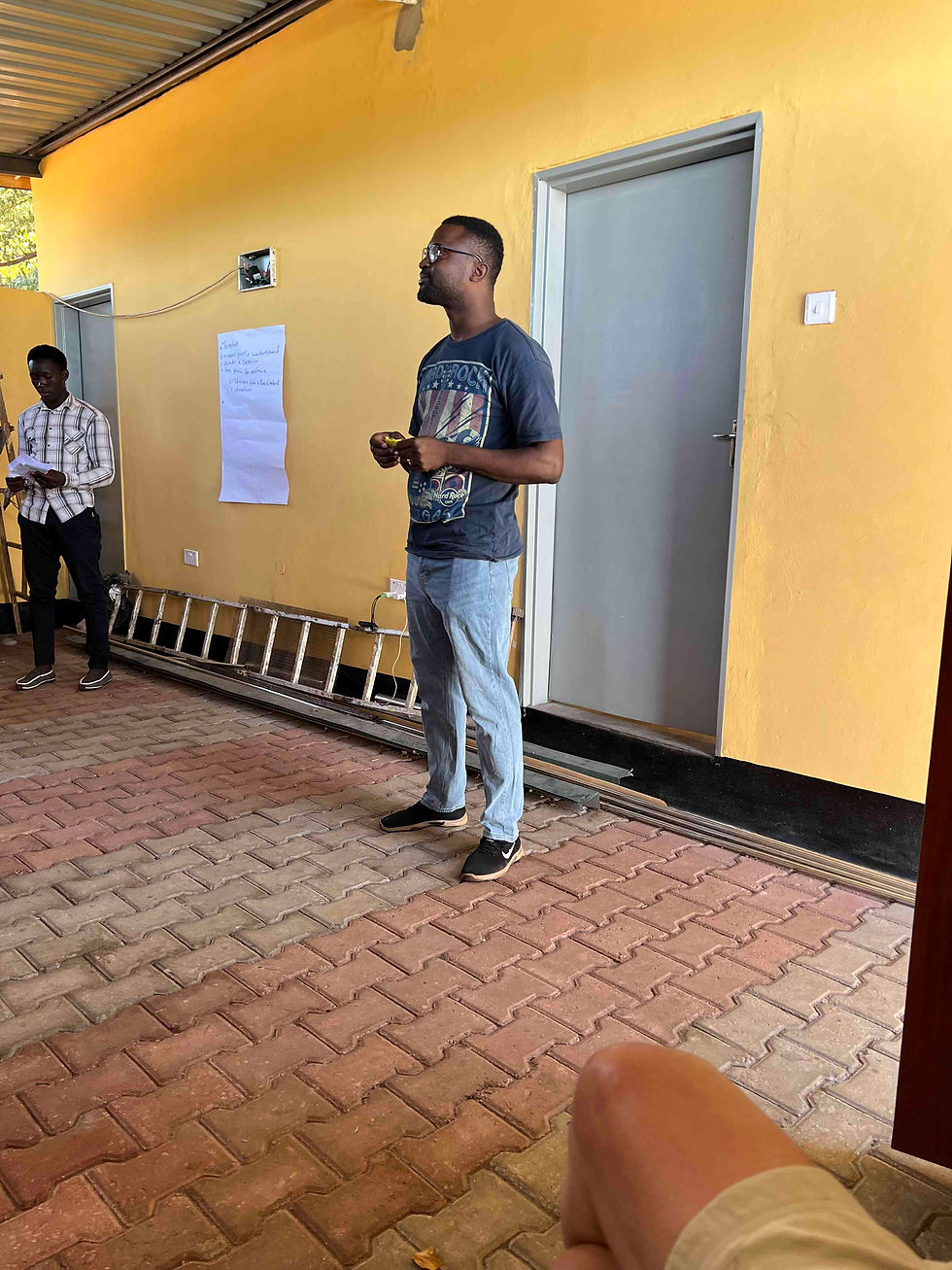Kaso from On Call Africa speaking to youth ambassadors in the Simonga youth-friendly space that Tonga Teen Corners funded
