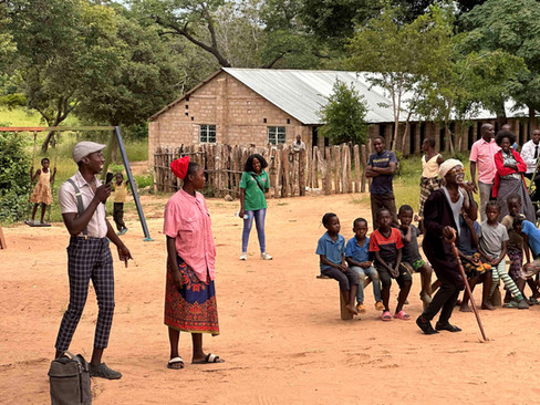 Boyd and other performing a play in front of local youth