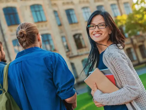 college admissions student in front of a university